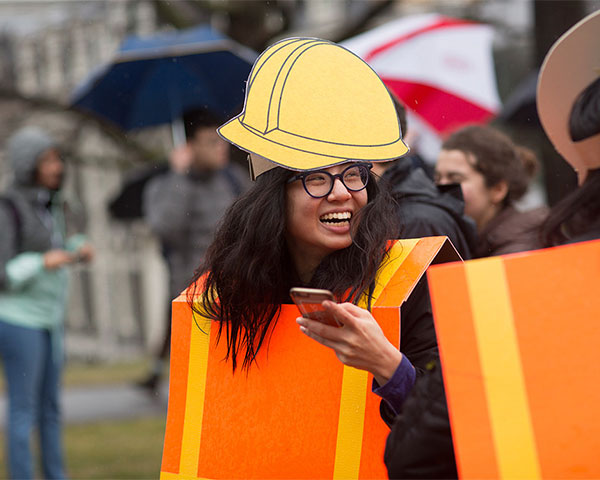 A costumed student dressed as a construction zone
