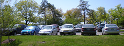 View of vehicles parked in a parking lot