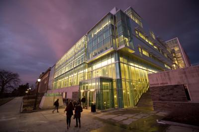 the Physical Sciences building lit up at night at Cornell University