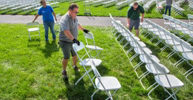 Chairs being set up in Schoellkopf Field